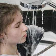 Wet Live Team: Nastya Lathers Her Breasts and Takes a Bath Fully-clothed