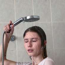 Wet Live Team: This Milf Knows a Lot about Getting Wet, Breasts Visible