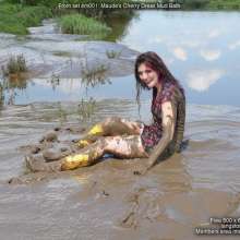 DungeonMasterOne: Maude in the mud in a cherry-print mini-dress and go-go boots!