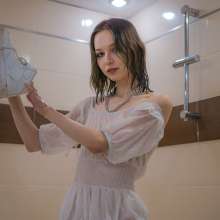 Wet Live Team: Mila in a Transparent Dress and Coat Is All Wet