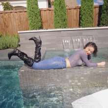 WetlookFashion: Elena Gets Wet in Jeans and Leather