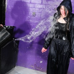 DungeonMasterOne: d/l: Chastity demonstrates the Saturation Hall approach to rainwear