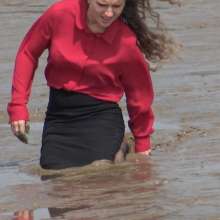 LisaMoomin: Alice in a red silk blouse and pencil skirt in the mud.