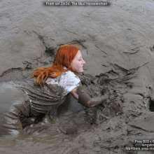 DungeonMasterOne: Mud!  Redhead Rosemary in black jodhpurs and boots in the mudbanks!