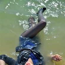 ufa217: Melisa in a dress swims in the lake.