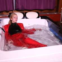 eileenvogel: W354 Eileen in red business suit relaxing in the bath after work