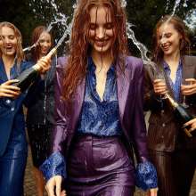 Wetmaxiskirts: AI wetlook: women in business suits (third selection)