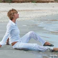 EuroWAM Team: Patricia plays in the sea dressed in white