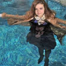 ufa217: Vanessa is a business lady swimming in a pool.