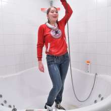 ufa217: Jessica takes a shower fully clothes.