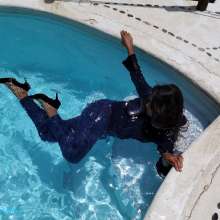Aqua: Pool in Blue Jeans, Blouse and Heels
