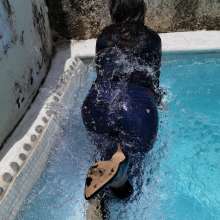 Aqua: Pool in Blue Jeans, Blouse and Heels