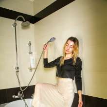 wet.look.me: Wetlook girl in tights, skirt and boots get wet in shower | Wetlook.biz