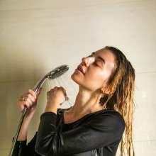wet.look.me: Wetlook girl in tights, skirt and boots get wet in shower | Wetlook.biz