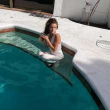 WetlookFashion: Natalie Takes a Dip in Her White Formal Jumpsuit.