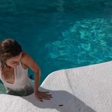 WetlookFashion: Natalie Takes a Dip in Her White Formal Jumpsuit.