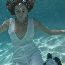WetlookFashion: Natalie Takes a Dip in Her White Formal Jumpsuit.
