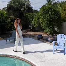 WetlookFashion: Natalie Takes a Dip in Her White Formal Jumpsuit.