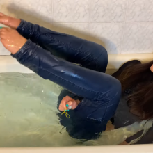 muddyfeet: Sexy woman wet in jeans in tub barefoot