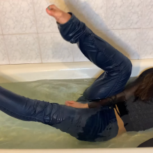 muddyfeet: Sexy woman wet in jeans in tub barefoot