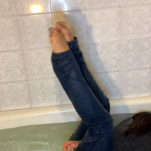 muddyfeet: Sexy woman wet in jeans in tub barefoot