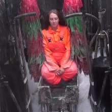 LiquidX: The Human Carwash: Michaela Orange Rainwear