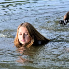 ufa217: Marianna in a business suit swims in the river.
