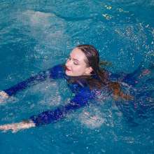 Wet Live Team: All Wet in the Pool Dressed in a Chic Blue Tracksuit