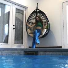 WetlookFashion: Lilith Swims in Flared Blue Jeans, Crop Top and High Heels