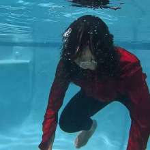 WetlookFashion: Natalie Swims in a Red and Black Business Outfit