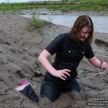 DungeonMasterOne: Miss Abigail belly-flops into the mud in a tight shiny jumpsuit!