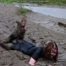 DungeonMasterOne: Miss Abigail belly-flops into the mud in a tight shiny jumpsuit!