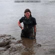 DungeonMasterOne: Miss Abigail belly-flops into the mud in a tight shiny jumpsuit!