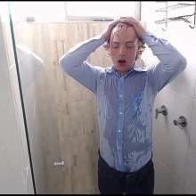 WETColours: Ross in the Shower Wearing a Light Blue Shirt and Jeans