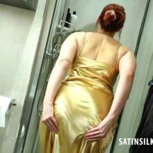 johnboy12: Miss Langford steps into the shower wearing a long golden satin chemise