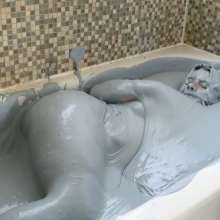 Stella: Stella takes a bath in a tub full of grey-t slime.
