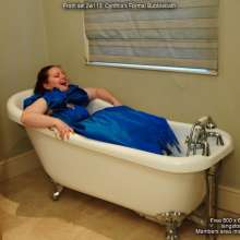 DungeonMasterOne: Redhead Cynthia takes a bubble-bath in a beautiful blue formal gown!
