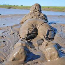 DungeonMasterOne: Mud!  Rosemary wears dungarees, white t-shirt, and denim jacket in the mud