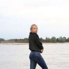 eileenvogel: Eileen in the river in jeans and fluffy jacket
