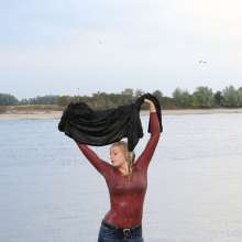 eileenvogel: Eileen in the river in jeans and fluffy jacket