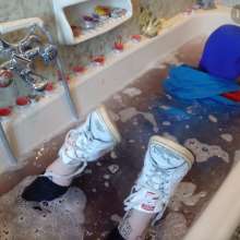 Ag Italian Wetlook: Ingrid fully-clothed in bathtub with old Stan Smith