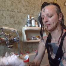 Ag Italian Wetlook: Ingrid fully-clothed in bathtub with old Stan Smith