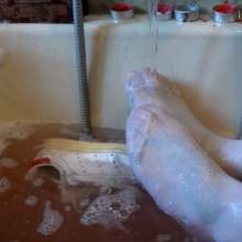 Ag Italian Wetlook: Ingrid fully-clothed in bathtub with old Stan Smith