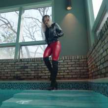 WetlookFashion: Camille in the Pool Wearing a Red and Black Leather Outfit