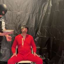 Musclestooge: A Onesie, a Beanie, and Pies
