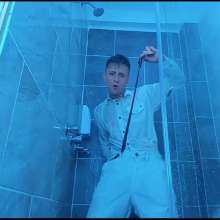 WETColours: Nico in the Shower Dressed in Total White