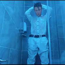 WETColours: Nico in the Shower Dressed in Total White