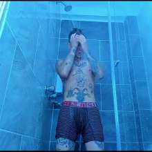 WETColours: Nico in the Shower Dressed in Total White