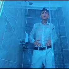 WETColours: Nico in the Shower Dressed in Total White