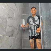 WETColours: Nico with the Football Shirt in the Shower